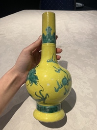A Chinese wucai 'flying horse' jar, a green-enamelled yellow-ground 'dragon' vase and a Nanking crackle-glazed jar, 19th C.