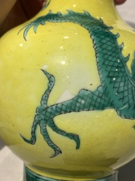 A Chinese wucai 'flying horse' jar, a green-enamelled yellow-ground 'dragon' vase and a Nanking crackle-glazed jar, 19th C.