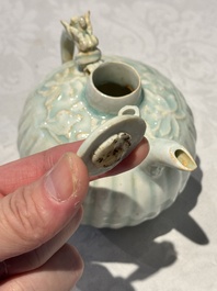 A pair of Chinese qingbai ewers and covers with dragon-form handles, Song/Yuan