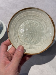 A pair of Chinese qingbai 'crane' plates and a tea bowl with stand, Song/Yuan