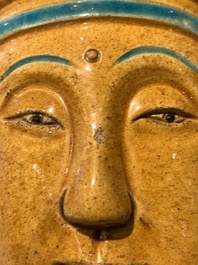 A large Chinese sancai-glazed Buddha, possibly from the Chengde Palace, Qianlong