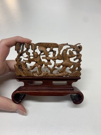 A Chinese octagonal gilt-lacquered wooden stand and four wooden carvings on stands, 19th C.
