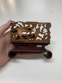 A Chinese octagonal gilt-lacquered wooden stand and four wooden carvings on stands, 19th C.