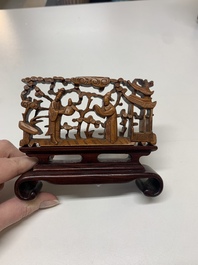 A Chinese octagonal gilt-lacquered wooden stand and four wooden carvings on stands, 19th C.