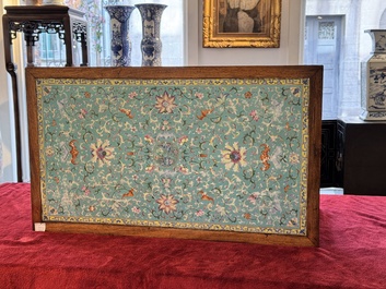 A Chinese famille rose turquoise-ground 'flower scrolls and bats' plaque, later mounted as table, Qianlong