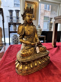 A large Sino-Tibetan gilt bronze Buddha, Xuande mark, possibly Ming