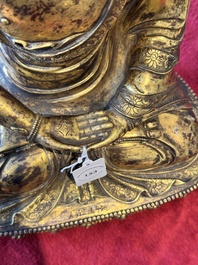 A large Sino-Tibetan gilt bronze Buddha, Xuande mark, possibly Ming