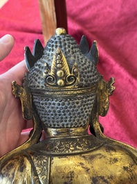 A large Sino-Tibetan gilt bronze Buddha, Xuande mark, possibly Ming