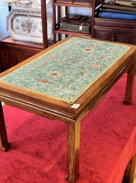 A Chinese famille rose turquoise-ground 'flower scrolls and bats' plaque, later mounted as table, Qianlong