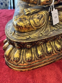 A large Sino-Tibetan gilt bronze Buddha, Xuande mark, possibly Ming