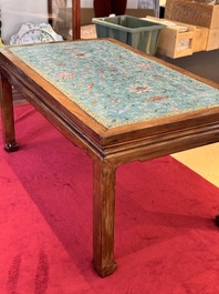 A Chinese famille rose turquoise-ground 'flower scrolls and bats' plaque, later mounted as table, Qianlong