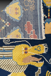A Sino-Tibetan inscribed woollen 'dragon' pillar carpet, 19th C.