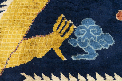 A Sino-Tibetan inscribed woollen 'dragon' pillar carpet, 19th C.