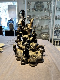 A rare Chinese bronze group depicting two immortals and various animals in a mountainous landscape, Ming