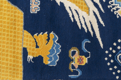 A Sino-Tibetan woollen 'dragon' pillar carpet, 19th C.