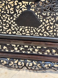 A large Chinese openworked wooden screen with famille verte and famille rose plaques, 18/19th C.