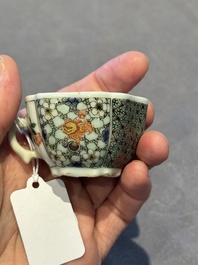 Two small Chinese famille verte handled cups with 'prunus on cracked ice' and 'shou' design, Kangxi