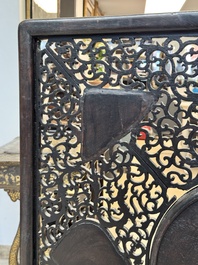 A large Chinese openworked wooden screen with famille verte and famille rose plaques, 18/19th C.
