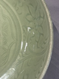 A Chinese Longquan celadon dish with floral design, Ming