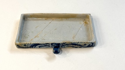 A blue and white Dutch Delft inkwell with pocket watch holder, 18th C.