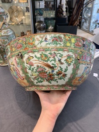 A Chinese Canton famille rose covered vase and two bowls, 19th C.