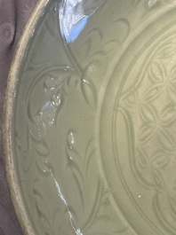 A Chinese Longquan celadon dish with floral design, Ming