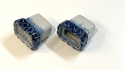 A blue and white Dutch Delft inkwell with pocket watch holder, 18th C.