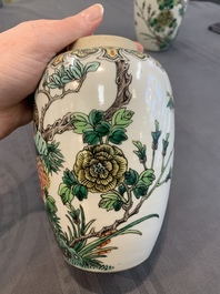 A pair of Chinese famille verte 'pheasant among flowering branches' vases and covers, 19th C.