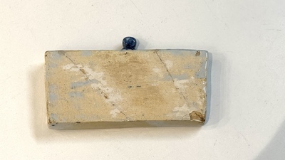 A blue and white Dutch Delft inkwell with pocket watch holder, 18th C.