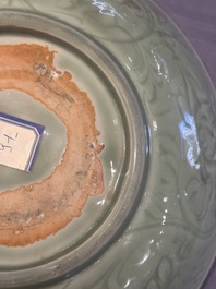A Chinese Longquan celadon dish with floral design, Ming