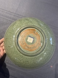 A Chinese Longquan celadon dish with floral design, Ming
