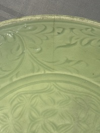 A Chinese Longquan celadon dish with floral design, Ming