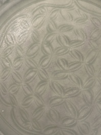 A Chinese Longquan celadon dish with floral design, Ming