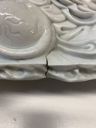 A Chinese Dehua blanc de Chine figure of a Luohan reclining on a tiger, Dehua and Bo Ji Yu Ren 博及漁人 mark, 20th C.