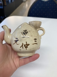 A Chinese Cizhou peach-shaped 'Lian Zhong San Yuan 連仲三元' ewer, Yuan/Ming