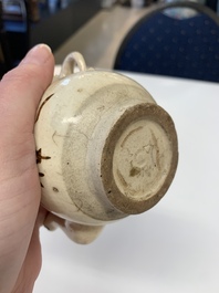 A Chinese Cizhou peach-shaped 'Lian Zhong San Yuan 連仲三元' ewer, Yuan/Ming