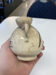 A Chinese Cizhou peach-shaped 'Lian Zhong San Yuan 連仲三元' ewer, Yuan/Ming