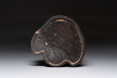 A rare and elegant Chinese Dehua blanc de Chine Guanyin on a wooden stand, Transitional period
