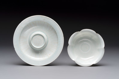 A pair of Chinese qingbai 'crane' plates and a tea bowl with stand, Song/Yuan