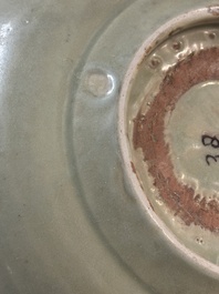 A Chinese Longquan celadon plate with floral design, Yuan/Ming