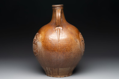 A large brown-glazed stoneware bellarmine jug, 17th C.