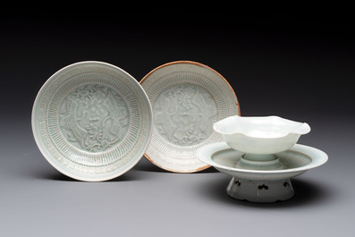 A pair of Chinese qingbai 'crane' plates and a tea bowl with stand, Song/Yuan