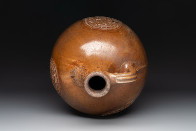 A large brown-glazed stoneware bellarmine jug, 17th C.