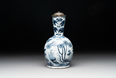 A blue and white Dutch Delft ewer with a mounted pewter lid, 17th C.