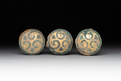 Three Chinese gilt-bronze ornaments with 'thunder' design, Han