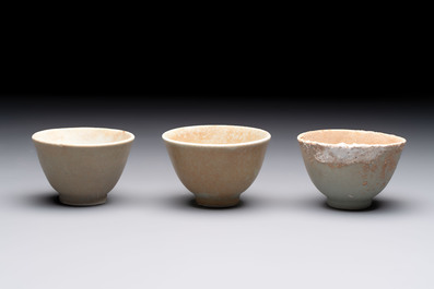 Thirteen Chinese blue and white 'Hatcher Cargo' cups and three celadon-glazed cups, Transitional period