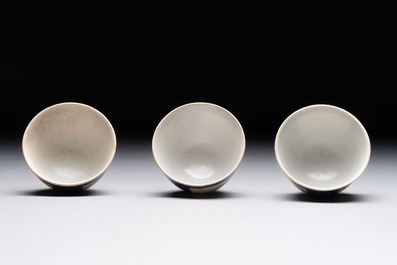 Thirteen Chinese blue and white 'Hatcher Cargo' cups and three celadon-glazed cups, Transitional period