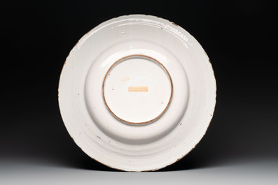 A large blue and white 'landscape and figures' dish, Frankfurt, 17th C.