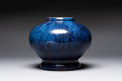 A Chinese flamb&eacute;-glazed vase on wooden stand, 19th C.