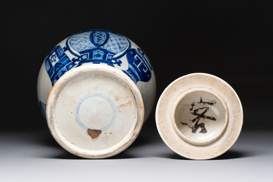 A Chinese blue and white vase and cover with calligraphy and antiquities, 19th C.